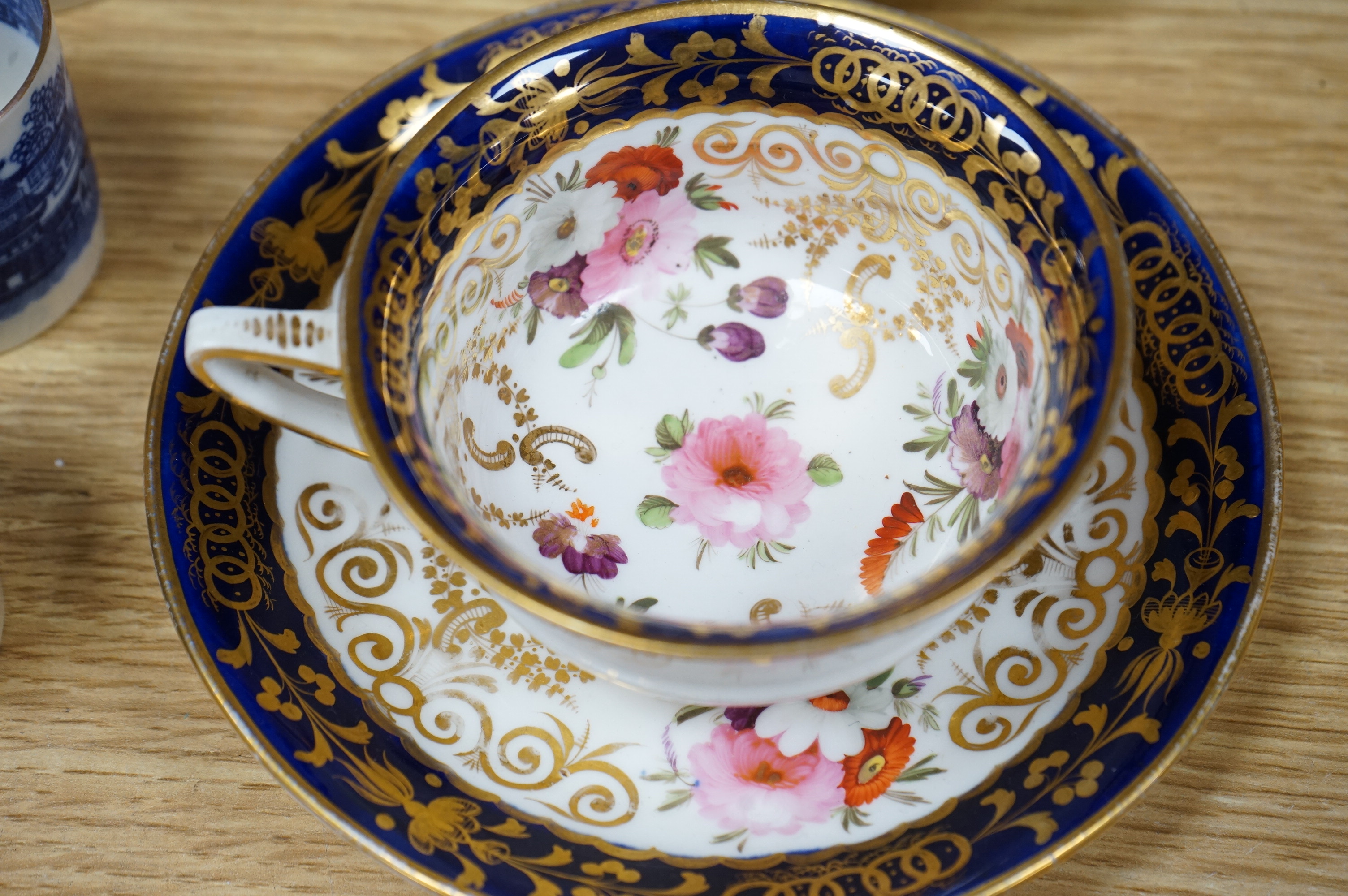 An English part teaset, c.1825 and six Royal Crown Derby coffee cans and saucers etc. Condition - some items cracked chipped and losses to gilding, teapot cover finial broken